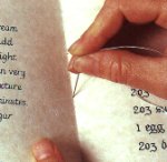 Sewing together the pages of a simple hand-written book